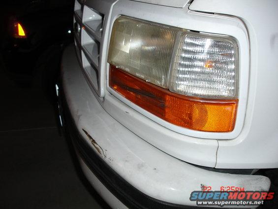 White 1996 Ford Bronco front corner with damaged bumper