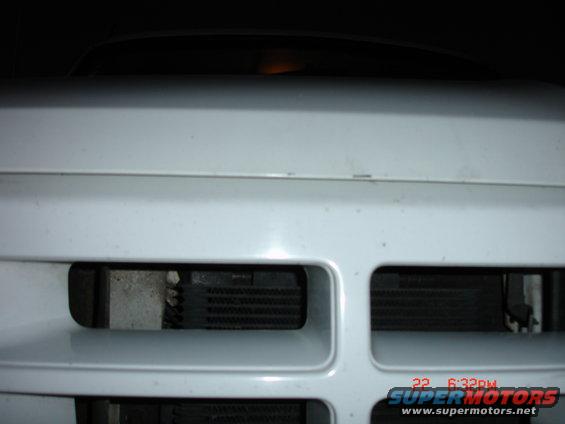 White grille with visible radiator fins, front view