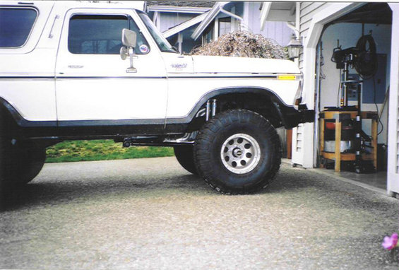 White 1979 Ford Bronco side view with lifted suspension and large tires