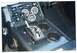 1979 Ford Bronco - The interior of a vehicle displays an aftermarket automatic transmission shifter and several gauges.