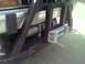 1994 Ford Bronco - Vehicle rear bumper with a winch and custom metal guard attached.