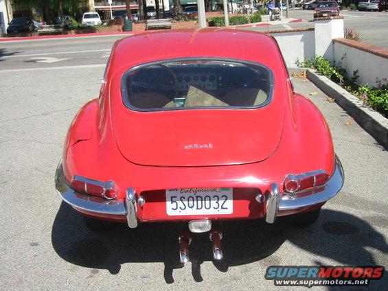 Red Jaguar E-Type coupe, rear view. California plate 5SQD032