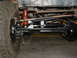 1994 Jeep YJ - Close-up view of a Jeep's suspension system, showing the differential and tire.
