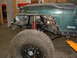1994 Jeep YJ - This 1994 Jeep YJ is undergoing front-end work, with the bumper and fender removed to access the suspension.