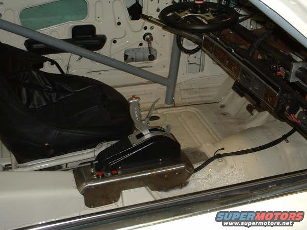 Interior of a 2005 Ford Mustang with racing seat and shifter