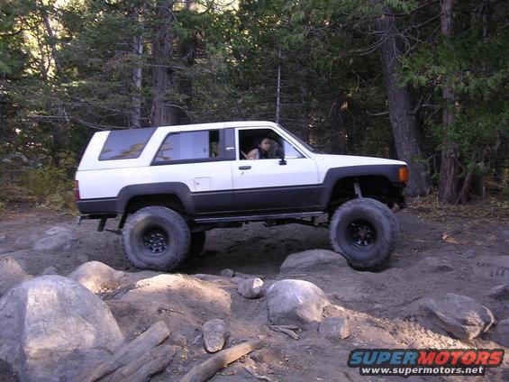 1985 Toyota 4Runner on a rocky trail, side view, white and black