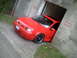 2006 Volkswagen GTI - A red Volkswagen sedan is partially backed into a concrete structure with 'DANGER KEEP OUT' stenciled on the walls.