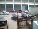 2006 Volkswagen GTI - A group of cars are gathered outside a large industrial building, with several vehicles displaying open hoods.