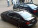 2006 Volkswagen GTI - Two Volkswagen sedans are parked outdoors, with people standing in the background.