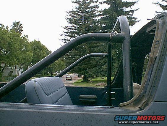 rollbarinstalled.jpg Here it is a few feet back. i am happy with this install. The kids like to hang on the bar as we go around town......one project done. i will update as i add parts to the cage.