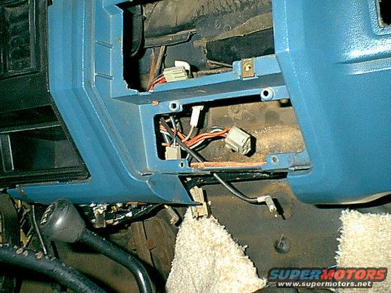 acdash3.jpg You can see the 4 stock holes that mounts the panel. 