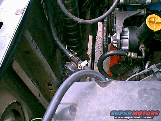 oldair4.jpg Here is the connection that failed. They put a iron pipe inside the hose and it rusted away. the hose was loose and leaked. this goes to the condenser in front of the raditor.