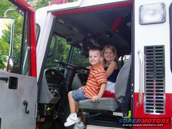 Children in fire truck interior