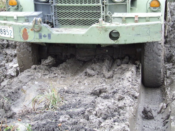 Military truck stuck in mud, license plate 8852 CANADA