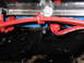 1973 Ford Ranchero - Close-up view of engine components, including red spark plug wires and a black exhaust manifold.