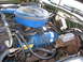 1973 Ford Ranchero - Engine bay detail showing the Ford V8 engine, air cleaner, and brake master cylinder.