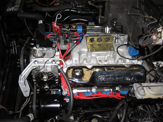Ford V8 engine with chrome valve covers and red spark plug wires