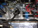 1973 Ford Ranchero - Close-up of an engine bay a carburetor, ignition coil, and a "POWER BY Ford" valve cover.