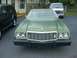 1973 Ford Ranchero - Front view of a green 1973 Ford Ranchero with a prominent grille and dual headlights.