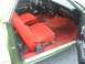 1973 Ford Ranchero - The interior of a 1973 Ford Ranchero features red velour seats and matching red carpet.