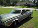 1973 Ford Ranchero - This 1973 Ford Ranchero features distinctive wood paneling along its sides and a green exterior.