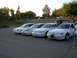 1995 Ford Taurus - A lineup of four white 1995 Ford Taurus sedans is captured from a three-quarter front view.