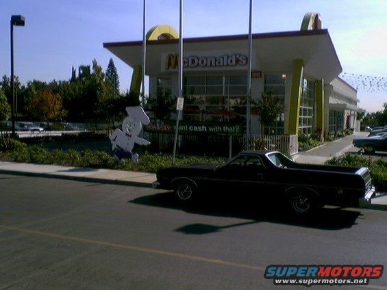 Black Ford Ranchero parked in front of a McDonald's