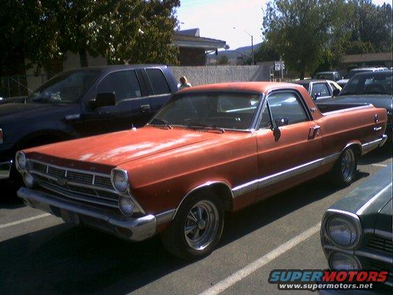Orange 1966 Ford Ranchero with chrome trim and aftermarket wheels, parked in a lot
