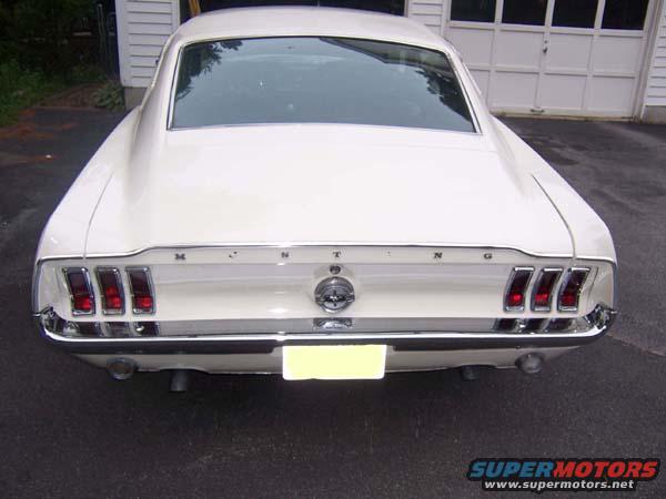 White 1968 Ford Mustang rear view with triple taillights