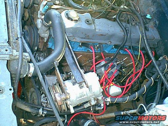 motor7.jpg i started by removing the bolts that held the compressor in place and the air cleaner and PCV and front oil vent plugs.