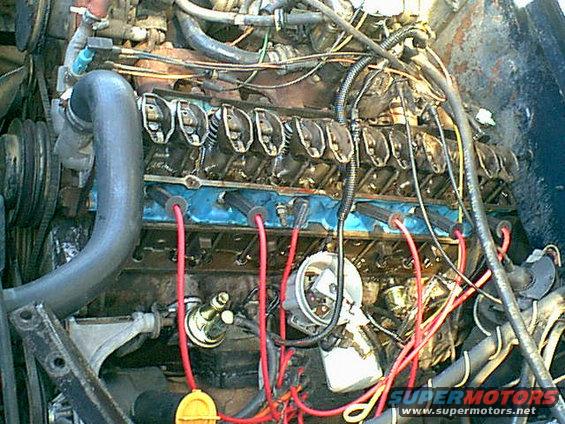 motor5.jpg Off came the fuel line from the pump to the carb then the valve cover and lifter valley cover.