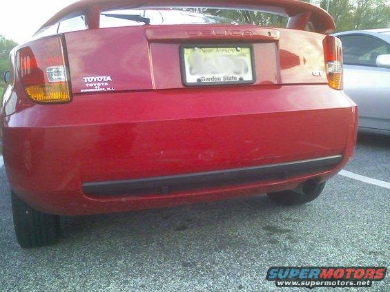 Red Toyota Celica rear bumper with New Jersey license plate and Toyota badging
