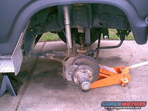 passnocoil.jpg The swap is sorta easy and fast. i removed the top of the shock and the top coil keeper and the bottom 1 1/8 nut on the retainer. i then dropped the jack and removed the coil.