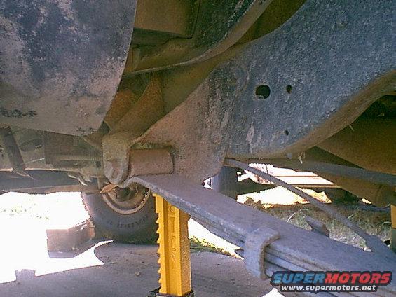 front-rear-spring-mount.jpg Here is the way the rear springs looked before i did anything. you can see the spring clamp is coming apart and the rubber bushing is trashed.