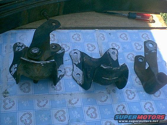 shackle-mount.jpg i found i had to cut the spring out and then grind off the rivets and beat them out. lots of noise and no fun. here are the stock mounts and stock shackles. (normally the mount folds up and bolts to the side of the shackle. i cut chopped the springs out)