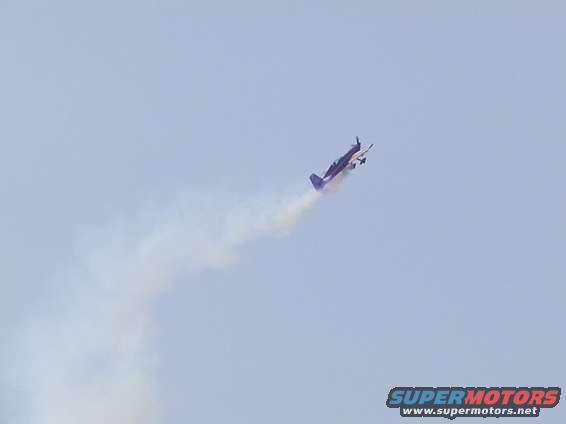 Extra 330XS doing some rolls. This guy did a crazy side-slip landing right from the end of a loop.  He's doing a loop, then suddenly he's on the ground.  Pretty wild.