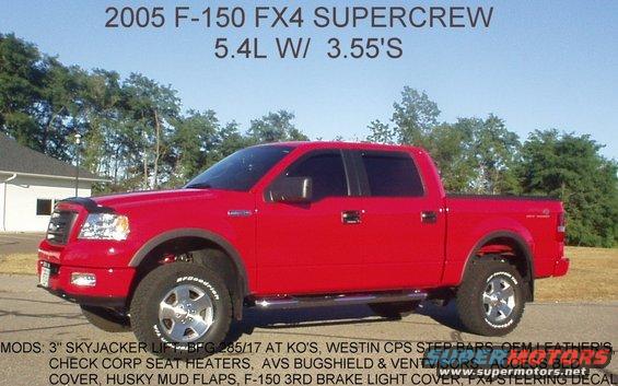 Red 2005 Ford F-150 SuperCrew pickup truck with aftermarket wheels and tires, parked outside