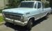 Light blue Ford pickup truck, likely a 1967 model, parked outside