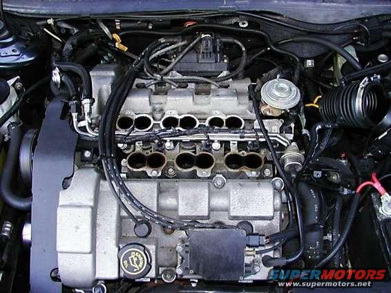 no_intake.jpg Intake plenum removed.  I later removed the lower intake manifold and injectors. After removing everything, I did a lot of scrapping and scrubbing.  I plan to run some intake cleaner though it later to get what I missed.  I noticed a difference in acceleration and smoothness after doing this work.
