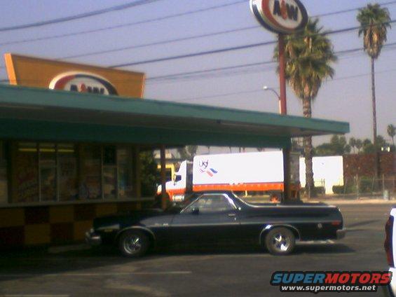 Black 1972 Ford Ranchero parked by an A&W drive-in