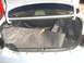 1997 Ford Probe - The interior of a car's trunk is shown with the lid open.