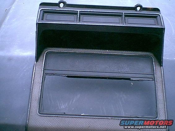 dash-cover.jpg Here is the stock bezel. i am not too worried about chopping it up as you can see the PO did to install a radio. this is the front. I will cut to fit the top section of the bezel.