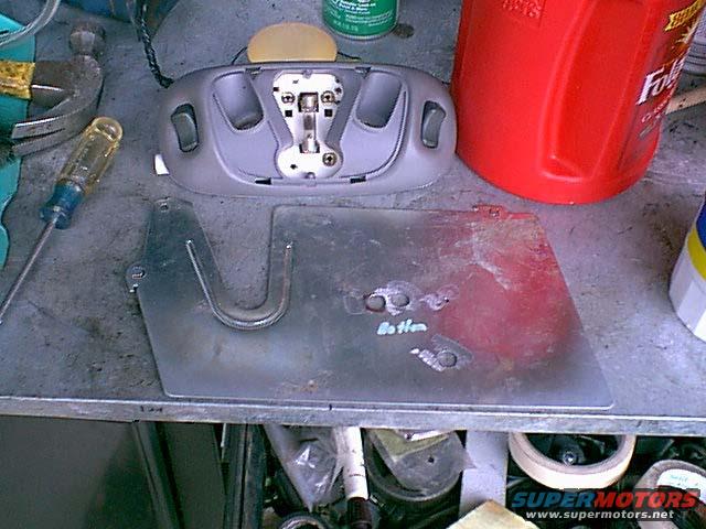 newdome4.jpg I made a new mount out of a file cabinet spacer. here you can see the mount holes for the wires and light.. the light came out of a 1992 Taruas car.