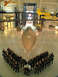 2001 Ford Crown Victoria - A group of people in tactical gear stand in front of a Blackbird aircraft inside a museum.