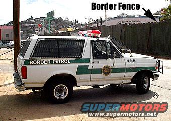 White Border Patrol SUV, green stripe, mesh rear windows, light bar, front push bar, 1992 model year
