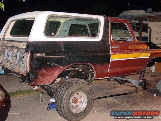 1978 Ford Bronco body on jacks, missing rear quarter panel and front clip