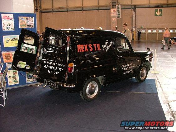 black van with REX'S T.V. Rentals & Repairs on side, address and phone number on back door