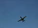 1982 Chevrolet C/K Pickup - An A-10 Thunderbolt II aircraft is seen flying against a clear blue sky.