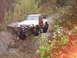 1990 Ford Bronco - Modified pickup truck with large tires navigating a rocky trail in an off-road setting.