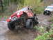 1990 Ford Bronco - Red Jeep Wrangler navigating a difficult rocky off-road course with a white Jeep Cherokee following.